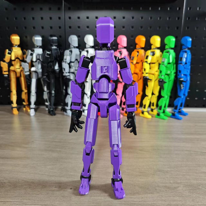 Orange 3D-printad robotfigur i pose