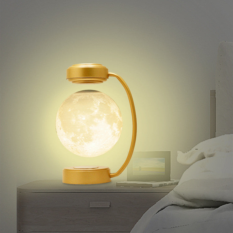 Svävande månlampa under svart båge